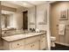 This bathroom features double sinks, granite countertops, a large mirror, and a walk-in shower at 9435 Tamarack Dr # 94, Indianapolis, IN 46260