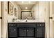 Classic bathroom vanity with dark wood cabinets and marble countertop, bright lighting, and clean interior design at 9435 Tamarack Dr # 94, Indianapolis, IN 46260