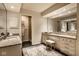 This bathroom features double sinks, granite countertops, a large mirror, and a walk-in shower at 9435 Tamarack Dr # 94, Indianapolis, IN 46260