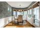Inviting dining area with a round table, four chairs, and views of the outdoor space at 9435 Tamarack Dr # 94, Indianapolis, IN 46260