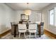 Cozy dining room with a stylish chandelier, a decorative buffet, and bright windows at 9435 Tamarack Dr # 94, Indianapolis, IN 46260