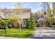 Beautiful home exterior with lush green lawn, mature landscaping, and inviting curb appeal at 9435 Tamarack Dr # 94, Indianapolis, IN 46260