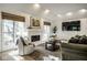 Inviting living area with a fireplace, open windows, and sophisticated decor creating a warm ambiance at 9435 Tamarack Dr # 94, Indianapolis, IN 46260