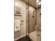 This bathroom features a glass-enclosed walk-in shower with a tiled surround and a towel rack at 9435 Tamarack Dr # 94, Indianapolis, IN 46260
