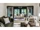 Bright sunroom showcasing elegant seating, an area rug, and views of the outdoors at 9435 Tamarack Dr # 94, Indianapolis, IN 46260
