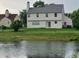 Picturesque backyard view of a house with a pond at 10629 Simsbury Ct, Indianapolis, IN 46236