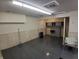 This basement features paneled walls, and a wash basin at 10629 Simsbury Ct, Indianapolis, IN 46236