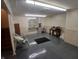 Finished basement with new flooring, and comfortable chairs at 10629 Simsbury Ct, Indianapolis, IN 46236