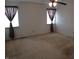 Bedroom with carpeted floors and two windows at 10629 Simsbury Ct, Indianapolis, IN 46236