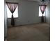 Spacious bedroom with neutral carpet and natural light from two windows at 10629 Simsbury Ct, Indianapolis, IN 46236