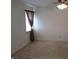 Bedroom featuring neutral carpet, and window with tied-back curtain at 10629 Simsbury Ct, Indianapolis, IN 46236