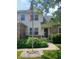 Home entrance with lush green plants and colorful flowers that create a warm, inviting, and beautiful curb appeal at 10629 Simsbury Ct, Indianapolis, IN 46236