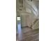 View of a home's entryway with staircase, wood floors, and natural light at 10629 Simsbury Ct, Indianapolis, IN 46236