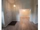 Inviting entryway featuring a front door with an entry rug and a view of the adjacent living spaces at 10629 Simsbury Ct, Indianapolis, IN 46236