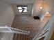Aerial view of a home's entryway with staircase, wood floors, and natural light at 10629 Simsbury Ct, Indianapolis, IN 46236