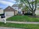Traditional home with a brick-accented facade, a well-manicured lawn, and a mailbox with the house number at 10629 Simsbury Ct, Indianapolis, IN 46236