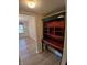 A hallway featuring a storage area and a view into the dining room at 10629 Simsbury Ct, Indianapolis, IN 46236