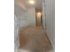 Second-floor hallway with carpet, white walls, and balusters, leading to various rooms at 10629 Simsbury Ct, Indianapolis, IN 46236