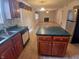 Spacious kitchen with island, stainless appliances, and modern countertops at 10629 Simsbury Ct, Indianapolis, IN 46236