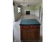 Open-concept living space features a kitchen with island and view to living room at 10629 Simsbury Ct, Indianapolis, IN 46236