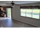 Open concept living space with kitchen, sliding doors, window and ceiling fan at 10629 Simsbury Ct, Indianapolis, IN 46236