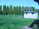 Private backyard with shed and mature trees at 10916 President Cir, Indianapolis, IN 46229