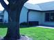 Spacious backyard with mature trees and a well-maintained lawn at 10916 President Cir, Indianapolis, IN 46229