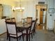 Elegant dining room with stylish furnishings and chandelier lighting at 10916 President Cir, Indianapolis, IN 46229
