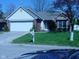 Charming one-story home with attached garage and well-maintained lawn at 10916 President Cir, Indianapolis, IN 46229