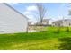 Backyard with wood deck, level lawn and mature landscaping offers outdoor enjoyment at 11631 Tucker Ct, Indianapolis, IN 46229