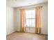 Bright bedroom featuring a window with curtains and neutral carpeting ready for personalization at 11631 Tucker Ct, Indianapolis, IN 46229
