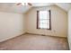 Neutral bedroom with window and ceiling fan, ready for personalization and move in at 11631 Tucker Ct, Indianapolis, IN 46229