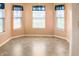 Light-filled dining area features three windows with bright blue curtains at 11631 Tucker Ct, Indianapolis, IN 46229