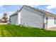 View of side of house showing siding, AC unit, and back yard at 11631 Tucker Ct, Indianapolis, IN 46229