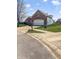 Lovely brick home featuring a well-manicured lawn and a paved driveway at 11631 Tucker Ct, Indianapolis, IN 46229
