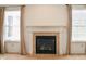Close up of the fireplace in the living room with white mantle and tile surround at 11631 Tucker Ct, Indianapolis, IN 46229