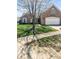 Well-maintained lawn and landscaping enhance the curb appeal of this brick home at 11631 Tucker Ct, Indianapolis, IN 46229