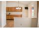 Eat-in kitchen includes cabinets, counterspace, and pass-through bar to the connected dining area at 11631 Tucker Ct, Indianapolis, IN 46229