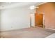 Spacious living area featuring neutral tones and a ceiling fan at 11631 Tucker Ct, Indianapolis, IN 46229