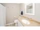 Bathroom features a single sink vanity, toilet, and shower with a white curtain at 1231 Chesterfield Dr, Anderson, IN 46012