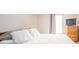 Bright bedroom featuring a plush bed, neutral walls, and a sunny window at 1231 Chesterfield Dr, Anderson, IN 46012