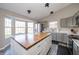 Spacious kitchen featuring stainless steel appliances, updated cabinets, and a large island at 1231 Chesterfield Dr, Anderson, IN 46012