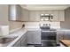 Modern kitchen featuring stainless steel appliances, marble countertops, and updated cabinets at 1231 Chesterfield Dr, Anderson, IN 46012
