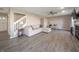 Living room showcasing an open floorplan, laminate flooring, and neutral-toned furnishings at 1231 Chesterfield Dr, Anderson, IN 46012