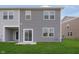 Exterior of a home with a well-maintained lawn, sliding glass door to enter the home at 1268 Newton St, Avon, IN 46123