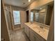 Bright bathroom with double vanity, glass shower, and tiled floors at 1268 Newton St, Avon, IN 46123