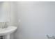 Half bathroom featuring a pedestal sink with chrome hardware at 1268 Newton St, Avon, IN 46123