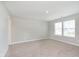 Spacious bedroom filled with natural light from two windows, carpet flooring and light walls at 1268 Newton St, Avon, IN 46123