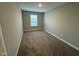 This carpeted bedroom features neutral walls and a window, offering natural light and comfortable living space at 1268 Newton St, Avon, IN 46123