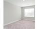 Neutral bedroom with light carpet, one window and white trim at 1268 Newton St, Avon, IN 46123